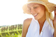 © peopleimages.com - Nature, happy and woman with sunhat for travel in countryside for vacation, adventure or getaway. Smile, journey and female person from Australia outdoor with accessory on holiday or weekend trip.