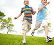 © peopleimages.com - Kids, outdoor and boys with energy, running and excited with nature, game and activity. Playground, friends and children with happiness, bonding together and summer with weekend break, cardio and fun