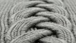 © DZIKRA  - Close-up gray cable knit texture; wool fabric detail
