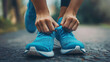 © otter2 - a close-up of a young woman's hands tying the laces of running shoes, symbolizing determination and health, soft natural lighting
