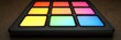 © DZIKRA  - Colorful music pad on wood; studio background.  Music production