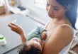 © peopleimages.com - Concerned mom, sick and baby with thermometer for fever, temperature or influenza at home. Worried, mother or infant with medical results, exam or test for virus, symptoms or viral infection at house
