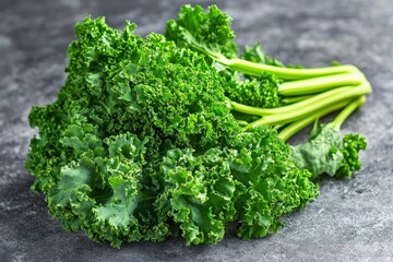 Wall Mural - Fresh kale bunch on gray stone background, healthy food ingredient