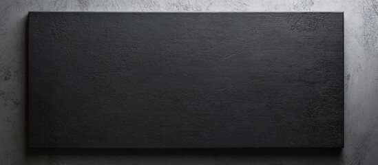 Aufkleber - Black textured surface with blank rectangular space for copy, suitable for creative or promotional backgrounds.