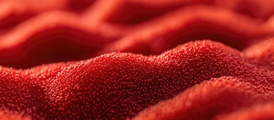 Poster - Close-up of textured red fabric with soft waves and ripples against a blurred background Copy Space
