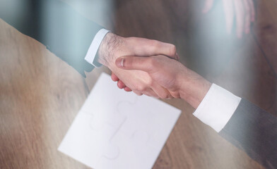 Wall Mural - top view of business people shaking hands during meeting