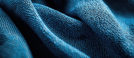 Sticker - Close-up of textured blue fabric showcasing intricate weaving patterns and folds with natural light highlighting the details Copy Space