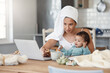 © peopleimages.com - Eating, baby or mother multitasking with laptop for remote work, author or freelance life balance in home. Biscuits, morning or mom juggling parenting task for responsibility, breakfast or deadline