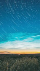 Wall Mural - Morning Sunrise In Countryside. Natural Background. Amazing Effect Of Cloud And Stars Trails. Timelapse Unusual Cloud And Stars Effects Above Countryside Rural Field Landscape With Young Green Wheat