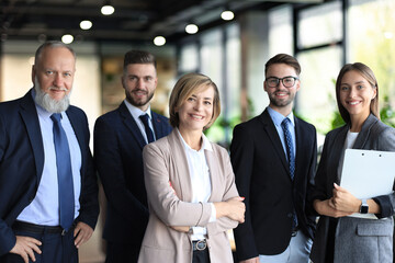 Poster - Group of successful business people on the background of the office.