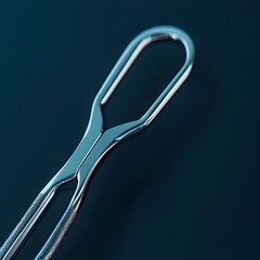 Wall Mural - Sleek surgical retractor isolated on a minimalist background with its metallic arms gleaming under soft light ready for use in delicate procedures