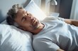 © nsit0108 - Mature man resting in bed, enjoying a peaceful sleep in his comfortable bedroom