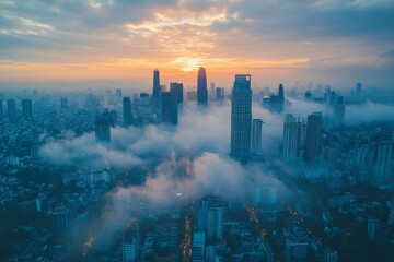 Poster - City skyline at sunrise with mist drifting among the skyscrapers in a vibrant urban landscape