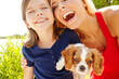 © peopleimages.com - Puppy, love and laughing with family in park for pet training, animal care and bonding. Happiness, loyalty and smile with mother and child with cocker spaniel dog for youth, relax and playful
