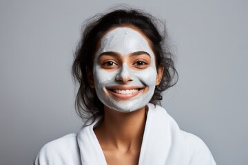 Wall Mural - South asian woman has mask cream on face portrait adult photo.