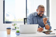 © Allistair F/peopleimages.com - Phone call, speaker and business black man with notes for planning, meeting schedule and reminder. Professional, corporate and person on smartphone for connection, communication and online contact