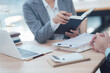 © Kritdanai - Legal Consultation: A lawyer carefully explains legal concepts to a client in a professional setting, emphasizing the importance of clarity and trust in the legal process. The image features a laptop.