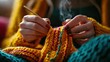© HoursStudio - Close-Up of Hands Knitting Colorful Yarn with Focus and Smoke in a Cozy Indoor Setting