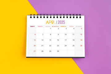 Wall Mural - April 2025 Monthly desk calendar for 2025 year on yellow and purple.