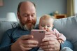© pisan - Discover modern fatherhood, a dad uses his smartphone to find baby care tips while feeding his adorable child, demonstrating a perfect balance of technology and parental love This snapshot highlights