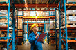 © Davor - Warehouse supervisor inspecting inventory with clipboard in storage facility