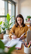 © Olga Nevskaya - Focused young woman taking notes in bright workspace, productivity