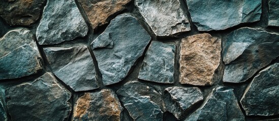 Wall Mural - Textured stone wall background with various sizes of irregular stones in grey and brown hues, ideal for architectural and design applications, Copy Space