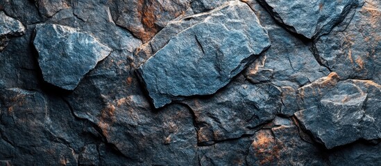 Wall Mural - textured background of dark slate stones arranged irregularly with natural variations and copy space