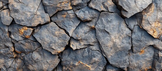 Wall Mural - textured dark gray rock wall surface with cracks and highlights, ideal for background or nature them