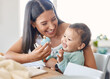 © peopleimages.com - Woman, baby and toys in home for bonding, child growth and love at table. Happy mother, toddler and family in living room with wooden block, protection and sensory development for learning with care