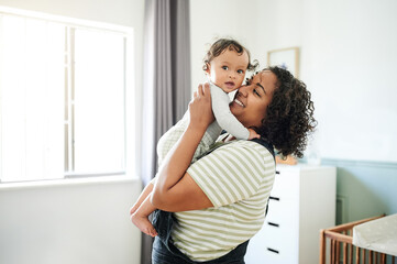 Sticker - Love, comfort and happy woman with her baby in nursery playing, bonding and spending quality time. Maternal, happiness and mother holding her infant boy child with a smile in bedroom at their home.