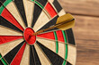 © chomphet - dart perfectly hits bullseye on colorful dartboard, symbolizing precision and success. vibrant segments of dartboard are clearly visible, enhancing focus on dart