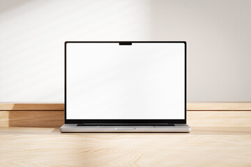 Wall Mural - opened laptop with blank white screen on the wooden desk