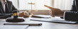 © Macrostock - concept of justice and law A male judge in the courtroom on a wooden table and a male counselor or lawyer working in the office. Law, advice and justice concepts