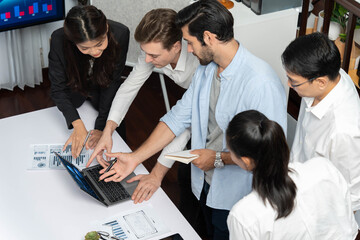 Leinwandbilder - Analyst team utilizing BI Fintech to analyze financial data at table in meeting room. Businesspeople analyzing BI dashboard power on paper for business insight and strategic marketing planning.Prudent