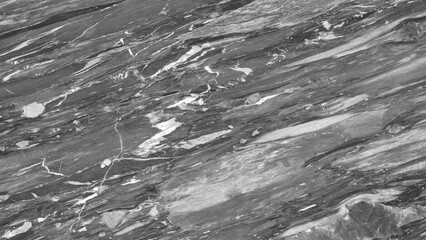 Leinwandbilder - background of a stone wall with a gray and white pattern. The wall looks like it is made of marble and has a rough texture. The photo creates a sense of depth and volume