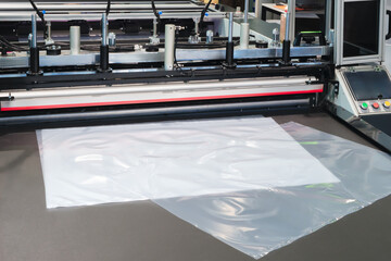 Poster - Industrial machine for production and printing of polyethylene bags. Industrial concept background