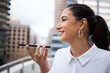 © peopleimages.com - Phone call, outdoor and business with woman, loudspeaker and buildings with financial advisor. Person, employee and consultant with cellphone, conversation and chatting with digital app or urban town