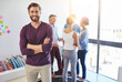 © Anne B/peopleimages.com - Portrait, business and man in workplace, arms crossed and editors with smile, startup and creative agency. Face, people and publishing company with teamwork, leadership and proofreader for magazine