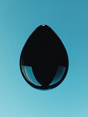 Leinwandbilder - Black drop suspended in midair against a vibrant blue background highlighting its unique shape and reflective surface. Generative AI
