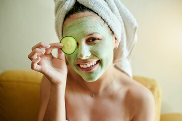 facial, vitamin c and woman with cucumber on eye or face for treatment, wellness and natural beauty 