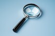 © top images - Magnifying glass is on a blue surface