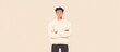© Svitlana - Pensive Young Asian Man, Arms Crossed, Beige Background