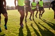 © peopleimages.com - Sports, men and legs with warm up for rugby, competition game and practice with training for tournament. Stadium, team and players with running for fitness, endurance and match with club by closeup