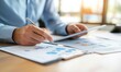 © Resni AI - Businessman analyzing financial charts and data on tablet in office