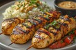 © Husien - Grilled chicken satay with rice and peanut sauce