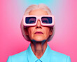 © Dadee - An elderly woman with stylish glasses against a vibrant background.