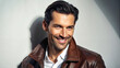 © Olga - Stylish man in leather jacket with a confident smile