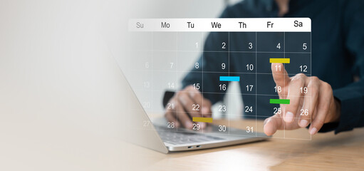 businessman manages time for effective work. calendar on the virtual screen interface, businessman p