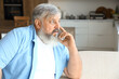 © Pixel-Shot - Afraid mature man at table in kitchen
